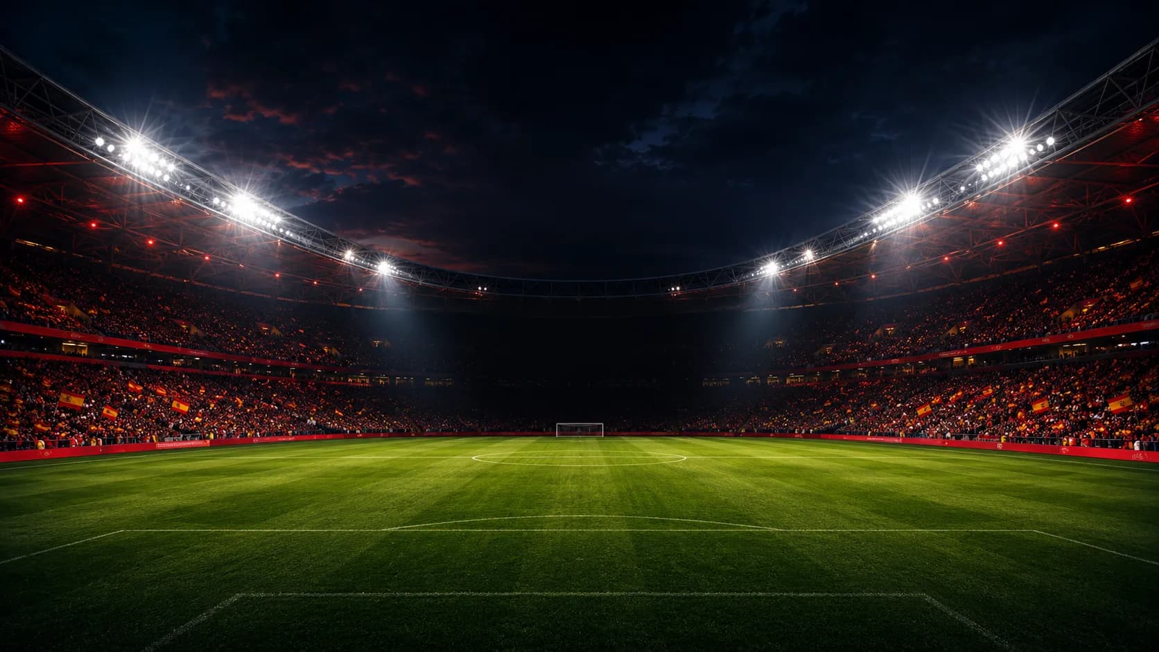 Estadio de fútbol nocturno con las gradas llenas y focos encendidos